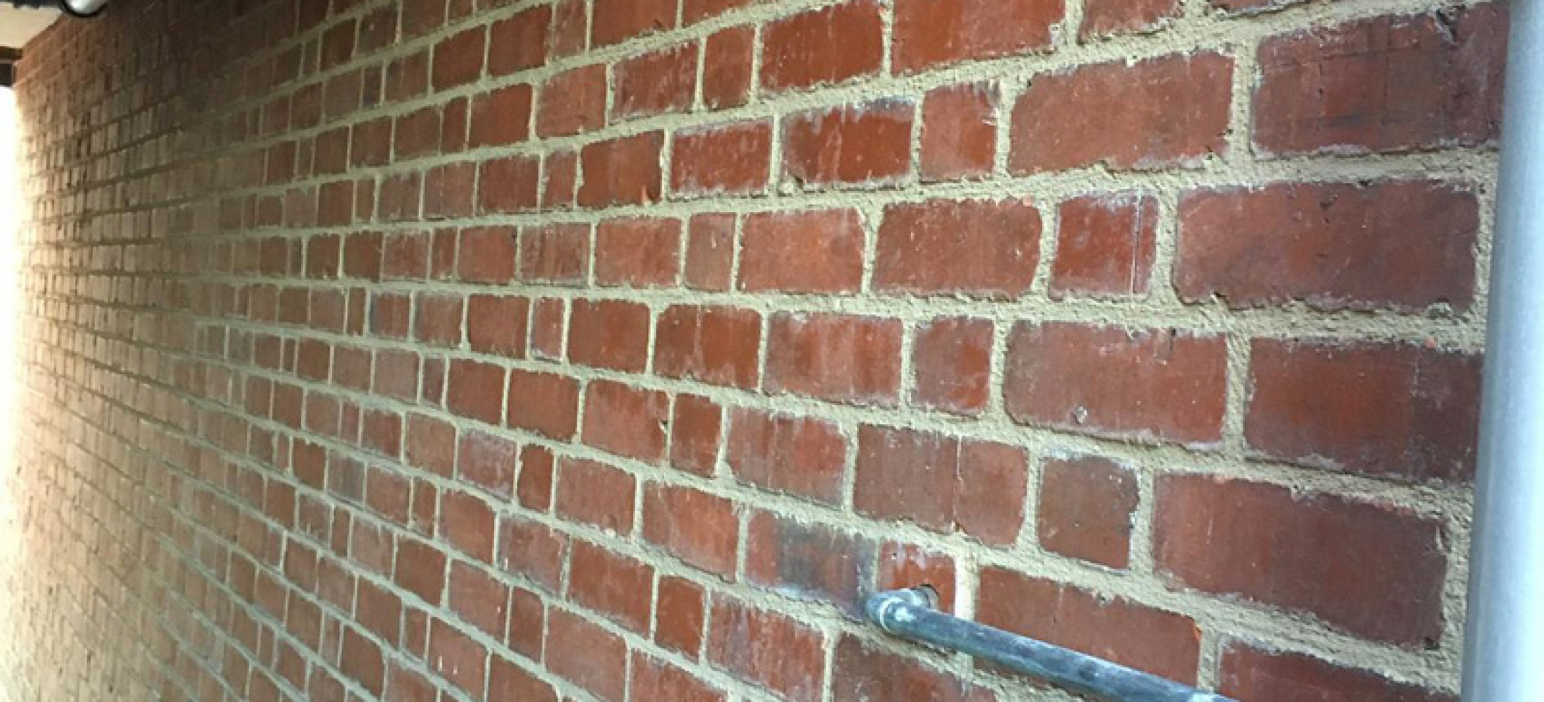 Raking out modern cement and repointing with traditional lime mortar